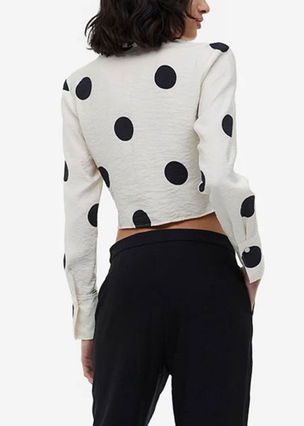 Cream Polka Dot Ruched Cropped Shirt (Category: Shirts) located in Cebu City. Submitted by mickaaay (Listing ID 1457261509, Image 2). Description: - Cream long-sleeved shirt - Black polka dot pattern - Ruched front detail - Button closure - Cropped length - Textured fabric finish - Versatile for casual or dressed-up outfits.