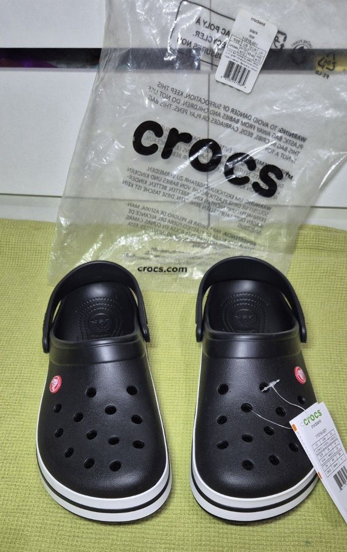 Crocs Crocband Clog in Black (Category: Slippers & Slides) located in Rosales. Submitted by georgiey0w (Listing ID 1457317379, Image 1). Description: -Original with tags and packaging from US. Included in the photos attached. -Below SRP. P3,795 on L@zada in Crocs' official store as of Aug. 24, 2026. -RFS: Padala, not my size and not a fan of crocs. 😅✌️ -Size: M 10 US -SF: C/o buyer.