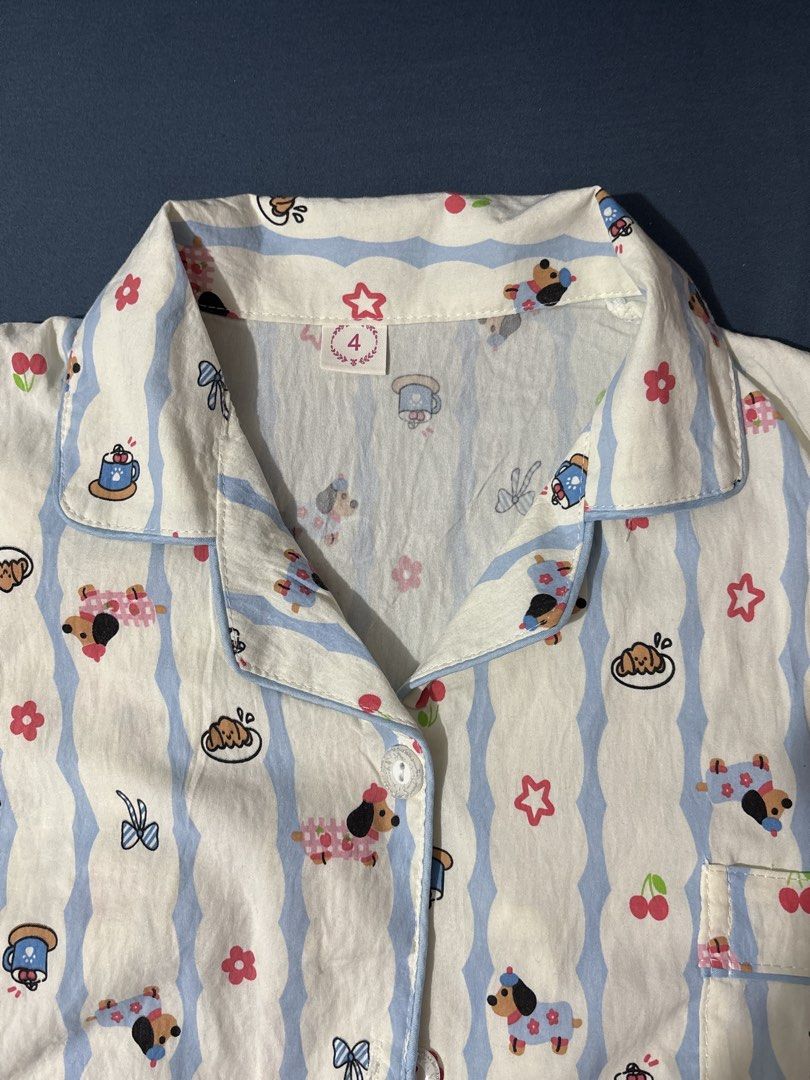 Cute Dog Print Pajama Set - Size 4 (Category: Undergarments & Loungewear) located in Pasay City. Submitted by mochasminimart (Listing ID 1457253894, Image 1). Description: -Pajama Set (Polo top w buttons & Pants) -Cute Oversized look -Comfy Pambahay -Only used once to try on (realized di sanay sa polo for sleep) -No issues .
