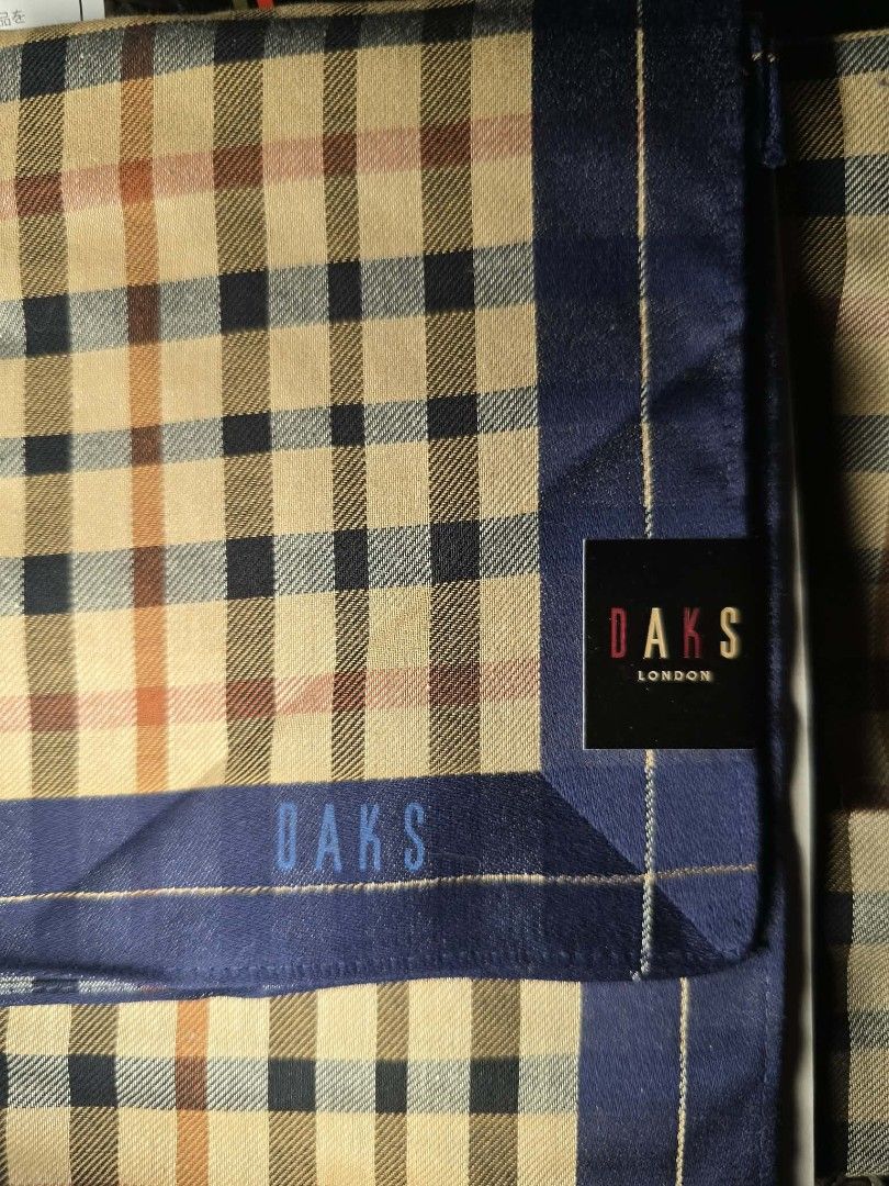 Daks London Checkered Handkerchief with gift Box (Category: Scarves) located in Zamboanga. Submitted by lunavinum (Listing ID 1457163301, Image 2). Description: - Authentic DAKS London handkerchief - Classic checkered pattern - Navy blue trim - Comes with original DAKS London box - Perfect accessory to complete your look - Ideal for gifting.