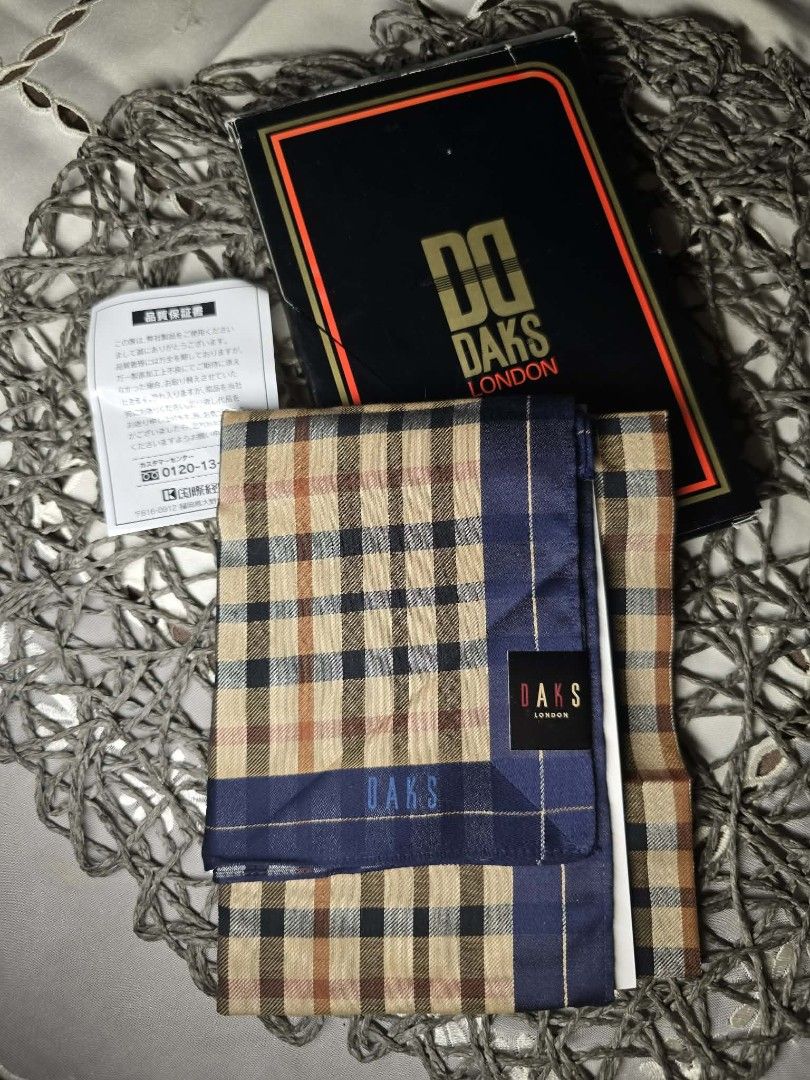 Daks London Checkered Handkerchief with gift Box (Category: Scarves) located in Zamboanga. Submitted by lunavinum (Listing ID 1457163301, Image 1). Description: - Authentic DAKS London handkerchief - Classic checkered pattern - Navy blue trim - Comes with original DAKS London box - Perfect accessory to complete your look - Ideal for gifting.