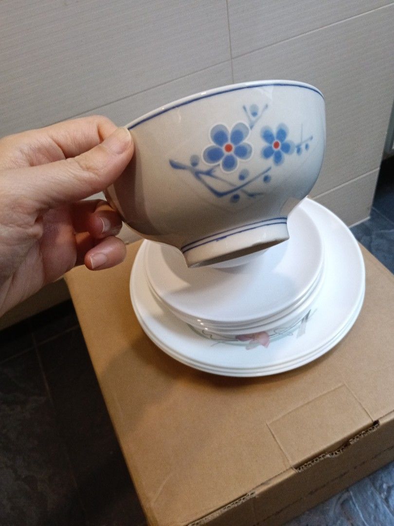 Dining set bundle (Category: Dinnerware & Cutlery) located in Singapore. Submitted by greeeenteaaaa (Listing ID 1457201032, Image 2). Description: set of 2 ceramic Chinese rice bowl 4 melamine dessert plate 3 conning wear plate selling as bundle for 5 dollars self collect only.