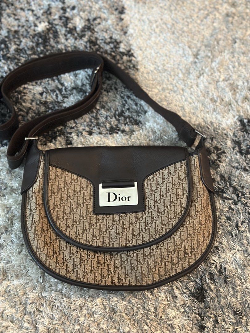 Dior Monogram Saddle Crossbody Bag (Category: Luxury Bags & Wallets) located in Manila. Submitted by timelessfindsbyjoann (Listing ID 1457302445, Image 1). Description: - Authentic Dior Saddle Bag - Classic monogram canvas - Dark brown leather trim - Adjustable strap - Silver-tone hardware with Dior logo plate - Timeless and versatile for everyday use.