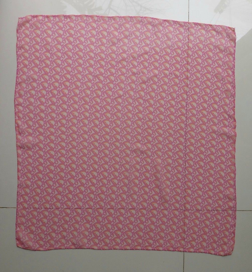 Dior Silk Scarf (Category: Scarves) located in Lapu Lapu. Submitted by agnesapm_29813 (Listing ID 1457267423, Image 3). Description: - Authentic Dior silk scarf - Iconic Diorissimo monogram pattern - Beautiful pink and orange colorway - Measurements: 22 inches x 23.5 inches - Versatile styling: neck, bag accessory, or hair tie - Missing tag - With runs, please see last picture - Washed and ironed already.