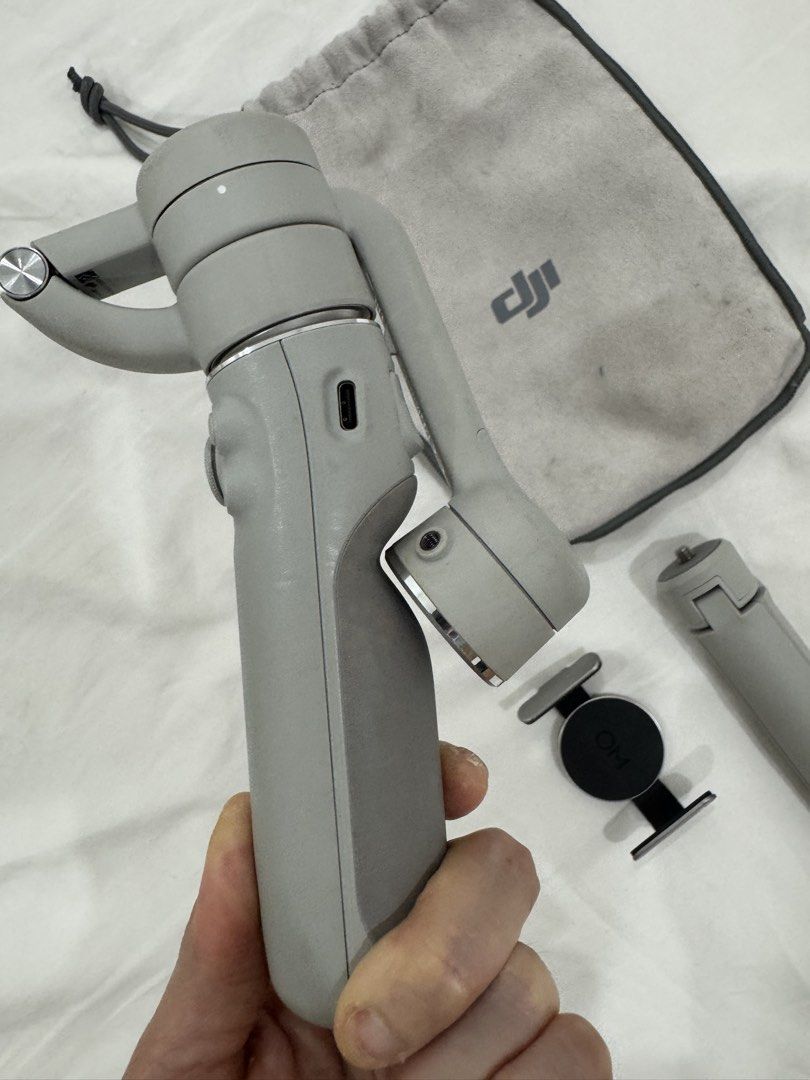 DJI OM 5 Gimbal Stabilizer with Accessories (Category: Gimbals & Stabilizers ) located in Quezon City. Submitted by heylouise (Listing ID 1457193109, Image 3). Description: - DJI OM 5 Gimbal - Perfect for smooth phone videos - Includes original pouch, tripod grip, and phone clamp - Easy to fold and portable for on-the-go filming - Ideal for content creators and enhancing your mobile videography - Feel free to ask any questions! No cable na but ty