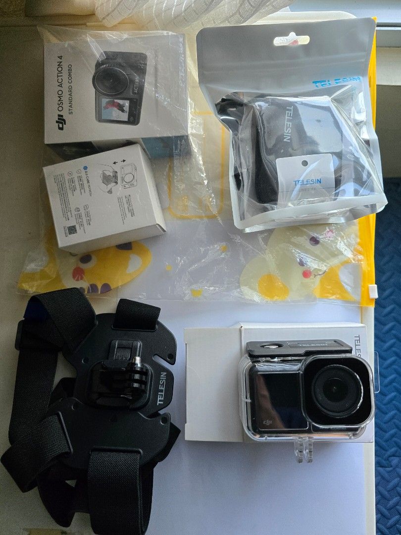 DJI Osmo Action 4 Accessories Bundle (Category: Cameras) located in Taguig. Submitted by mayari63 (Listing ID 1457231308, Image 3). Description: - Complete Telesin accessory bundle for DJI Osmo Action 4 - Includes: Waterproof Case, Chest Mount Harness, Protective Frame - Also includes various small parts for added functionality - Ideal for capturing all your adventures and action shots - High-quality accessories from Telesin Usage: Primarily used