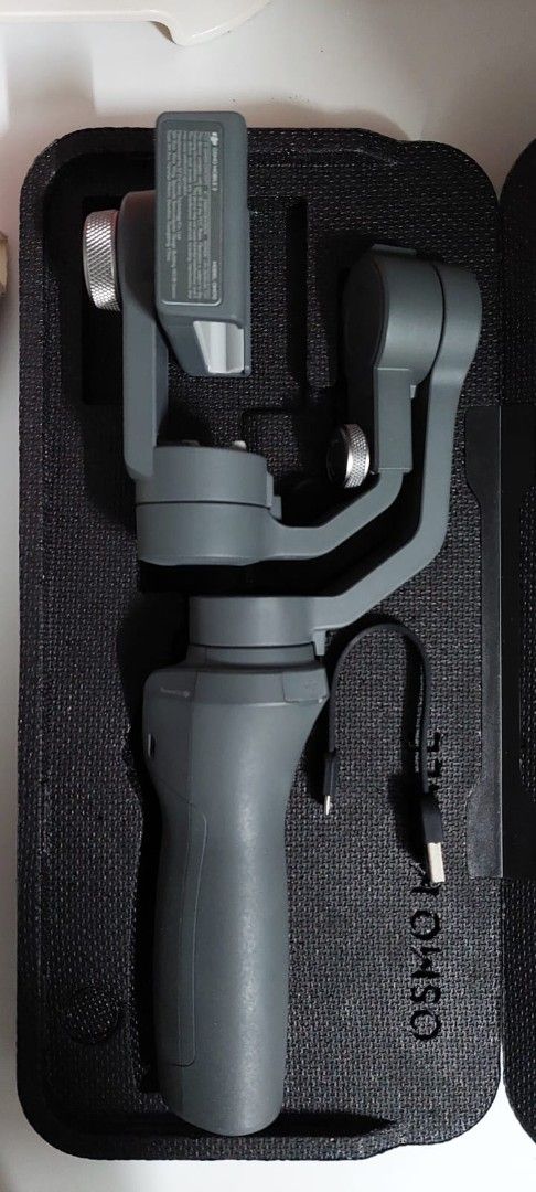 DJI Osmo Mobile 2 Gimbal Stabilizer for Smartphones (Category: Gimbals & Stabilizers ) located in Manila. Submitted by roblazo25 (Listing ID 1457161486, Image 2). Description: - DJI Osmo Mobile 2 Gimbal - Creates incredibly smooth video footage - Compact and foldable design for easy travel - Includes original carrying case - Includes original charging cable - Ready for your next creative project.