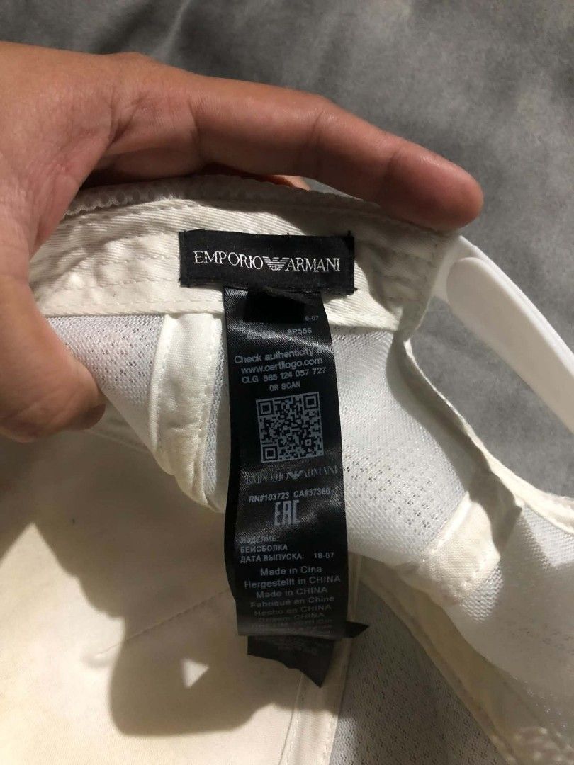 Emporio Armani White Cap (Category: Caps & Hats) located in Castillejos. Submitted by fnds_wr (Listing ID 1457320003, Image 3). Description: - Authentic Emporio Armani cap - White trucker style - Iconic eagle logo embossed on front - Breathable mesh back - Made in China - Authenticity can be checked on certilogo.com or armani.com.