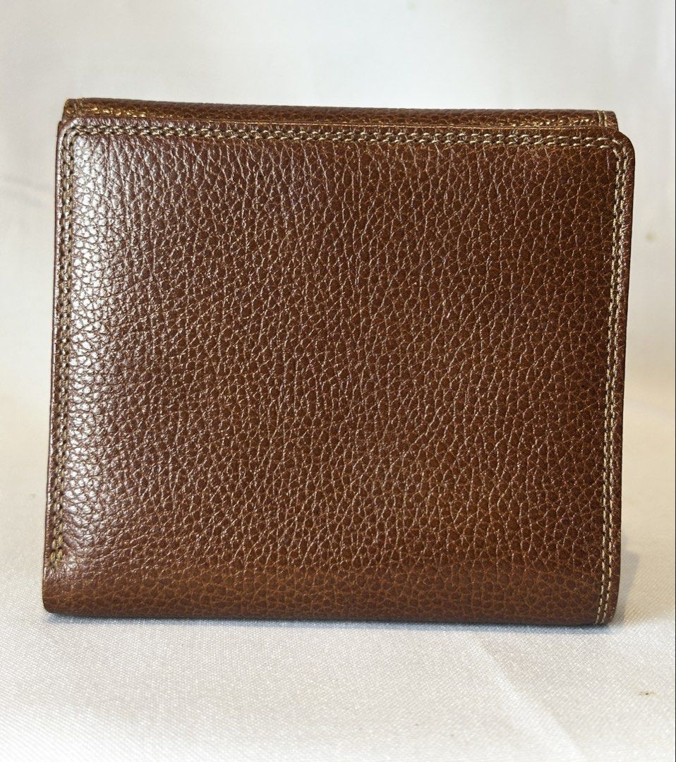 FILA Brown Leather Bifold Wallet (Category: Luxury Bags & Wallets) located in Manila. Submitted by originalvintagebagph (Listing ID 1457309041, Image 3). Description: - Brand: Fila - Material: Brown Textured Leather - Design: Bifold Wallet - Features: Stitched detailing, multiple interior card slots, snap closure - Style: Classic, compact, ideal for everyday use.