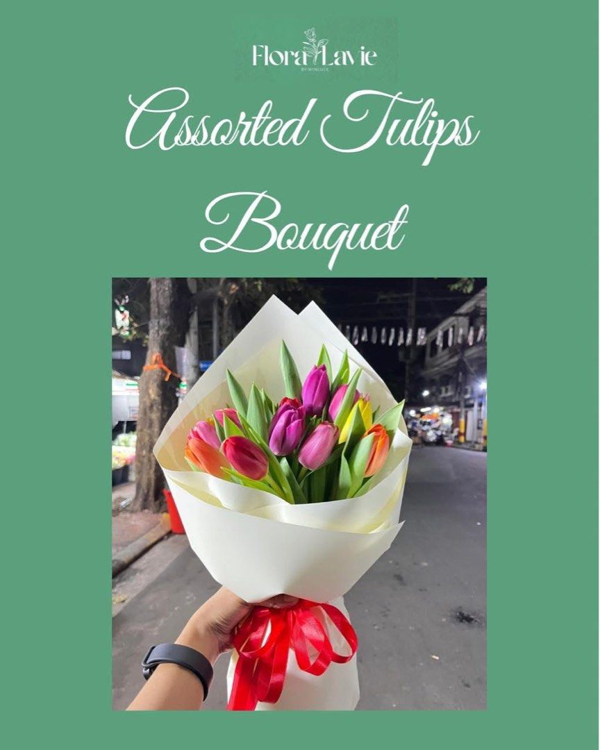 Flora Lavie Assorted Tulips Bouquet (Category: Flowers & Bouquets) located in Paranaque City. Submitted by meripalisoc (Listing ID 1457154634, Image 1). Description: - Beautiful assorted tulips bouquet by Flora Lavie. - Vibrant mix of pink, purple, orange, and yellow tulips. - Elegantly wrapped in white paper with a red ribbon tie. - Ideal for gifting or adding a pop of color to any space. - Fresh and lovely blooms. - Our shop is located in Dangw