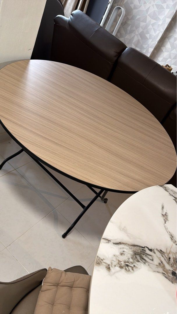 Foldable Table with Stackable Grey Stools (Category: Tables & Sets) located in Singapore. Submitted by jantee (Listing ID 1457249891, Image 2). Description: 🚚 Arrange your own delivery/Self pick-up - Round wood grain table 120cm - Sturdy black metal legs - Includes 4 stackable grey MAXIL stools - Versatile: Use for dining or as a workspace - Space-saving design, easy to store and move - Ideal for compact living areas.