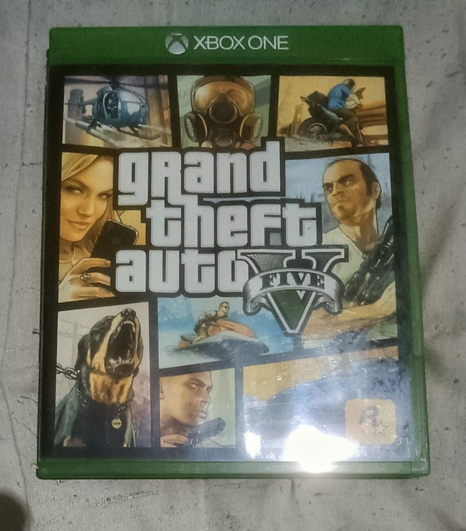 Grand Theft Auto V - Xbox One (Category: Xbox) located in Bulacan. Submitted by carou13325 (Listing ID 1457196389, Image 1). Description: - Grand Theft Auto V for Xbox One - Classic open-world action game - Explore the vast world of Los Santos and Blaine County - Play as three distinct protagonists: Michael, Franklin, and Trevor - Packed with numerous missions and engaging activities - Perfect for long-time fans of the Grand Theft Auto series.