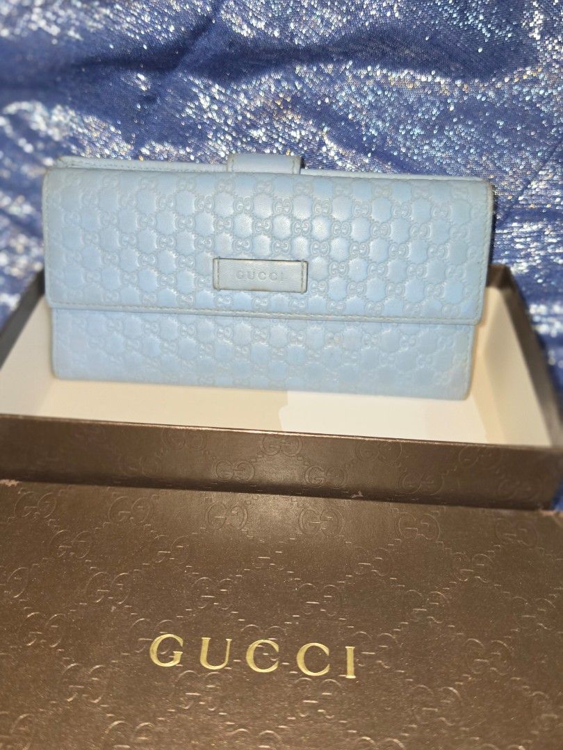 GUCCI Leather Wallet Light Blue (Category: Luxury Bags & Wallets) located in Quezon City. Submitted by mineg (Listing ID 1457231527, Image 1). Description: - Authentic light blue Gucci wallet - Features the signature Microguccissima pattern all over - Comes with its original Gucci box.