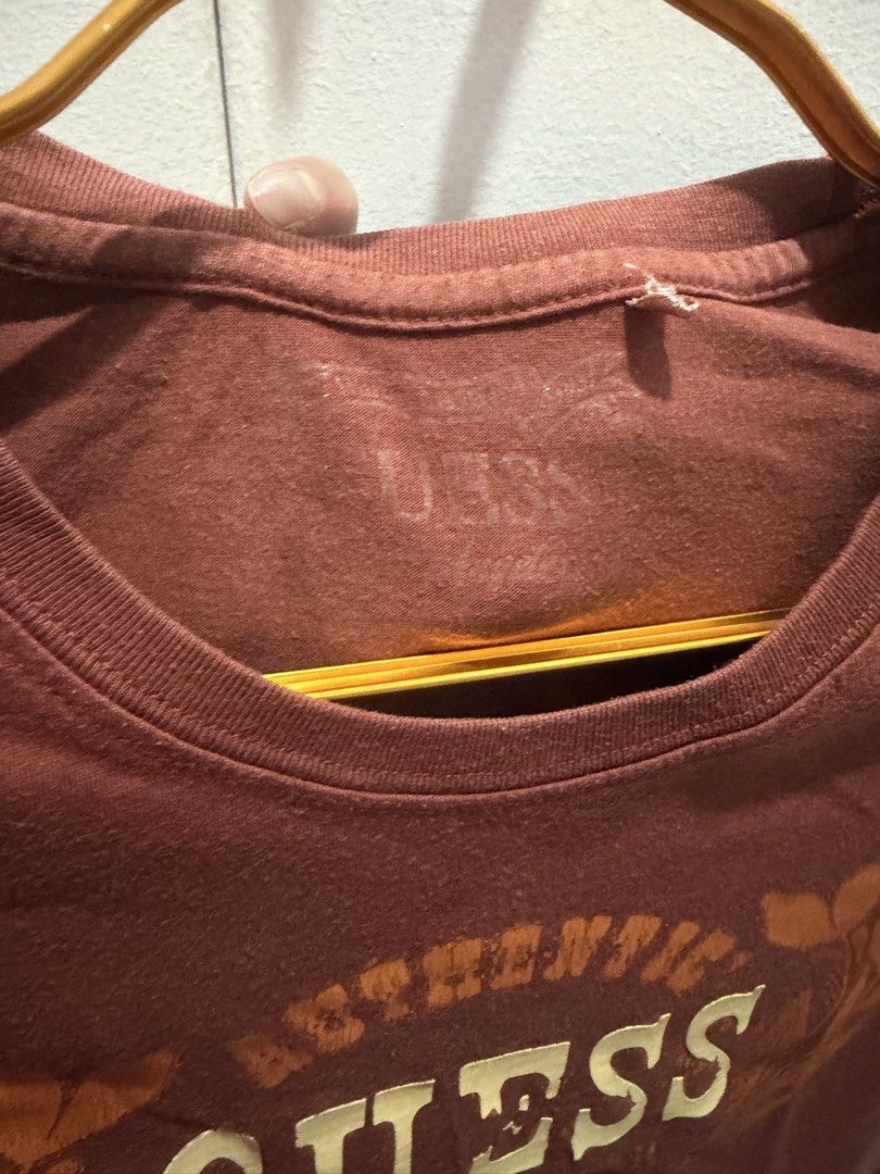 GUESS Authentic Vintage Graphic Tee – Rust / Maroon (Y2K Style) (Category: Shirts) located in Taguig. Submitted by monethambas (Listing ID 1457293506, Image 3). Description: Description: Selling a vintage GUESS graphic t-shirt in a nice rust brown/maroon shade. Features a bold front graphic reading “Authentic GUESS Denim Pioneer Est. 1981”. Perfect for Y2K, casual vintage, or retro street style looks..