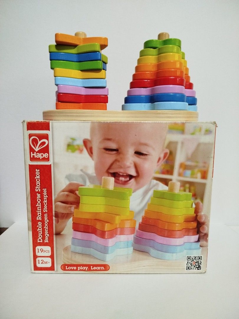 Hape Double Rainbow Stacker Wooden Toy (Category: Educational & Learning Toys) located in Marikina City. Submitted by shoptrevandtim (Listing ID 1457276882, Image 1). Description: - Hape Double Rainbow Stacker - Includes 19 colorful wooden pieces - Recommended for ages 12 months and up - Helps develop color recognition and stacking skills - Promotes imaginative play and early learning.
