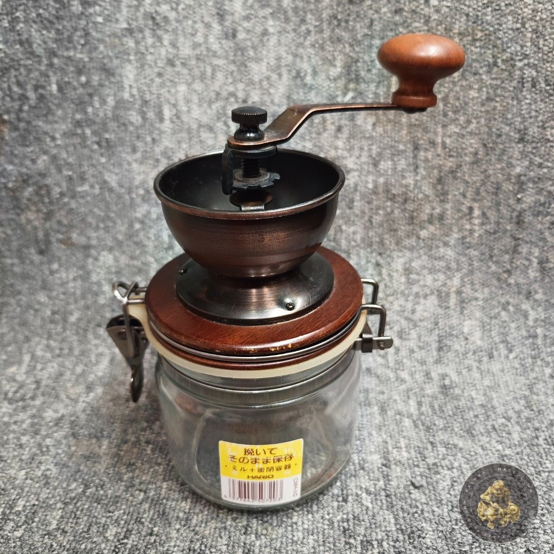 Hario Canister Ceramic Coffee Mill (Category: Coffee & Tea Tableware) located in Meycauayan. Submitted by ka_luma (Listing ID 1457164328, Image 1). Description: Hario Canister Ceramic Coffee Mill (model CMHN-4), a manual grinder that allows you to grind fresh coffee beans directly into an airtight glass storage jar..