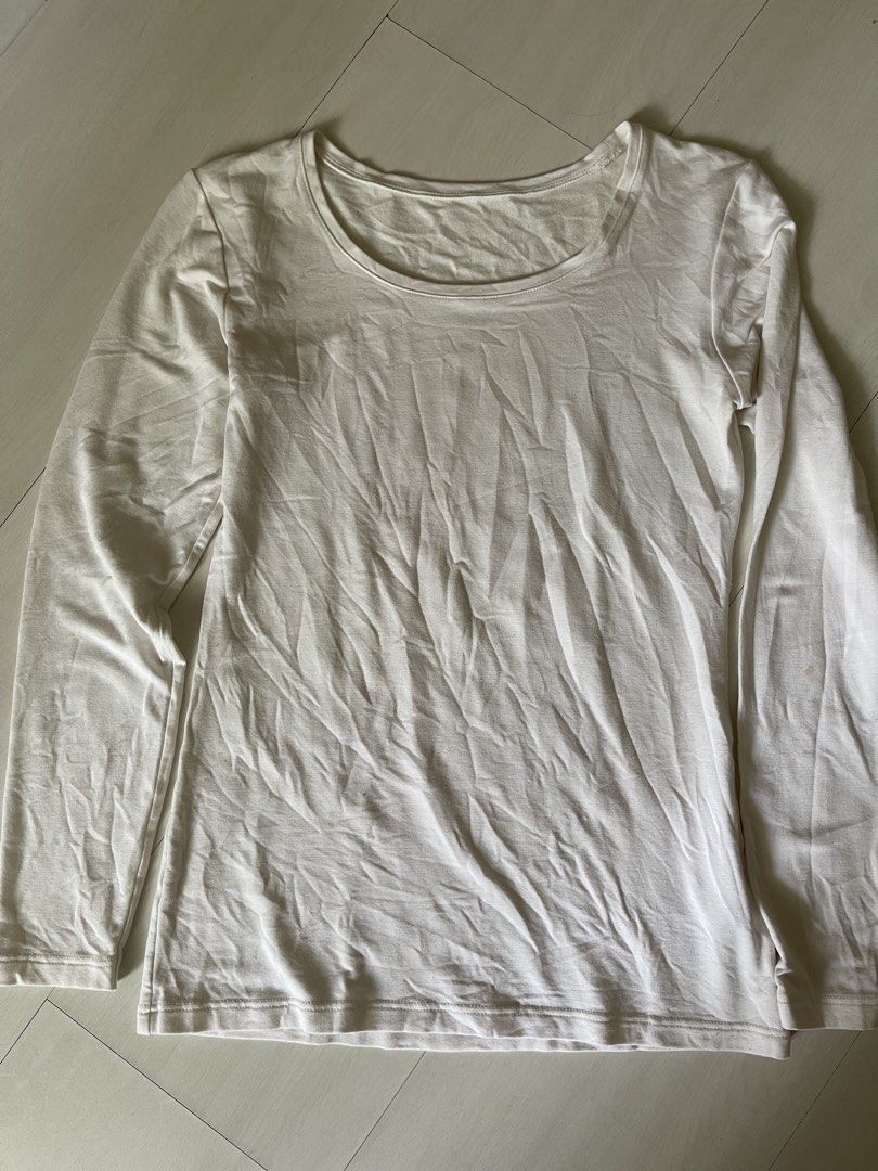 Heattech extra warm small (Category: Longsleeves) located in Quezon City. Submitted by booktt (Listing ID 1457191088, Image 1). Description: extra warm white small with small stain on sleeves as shown on pic.