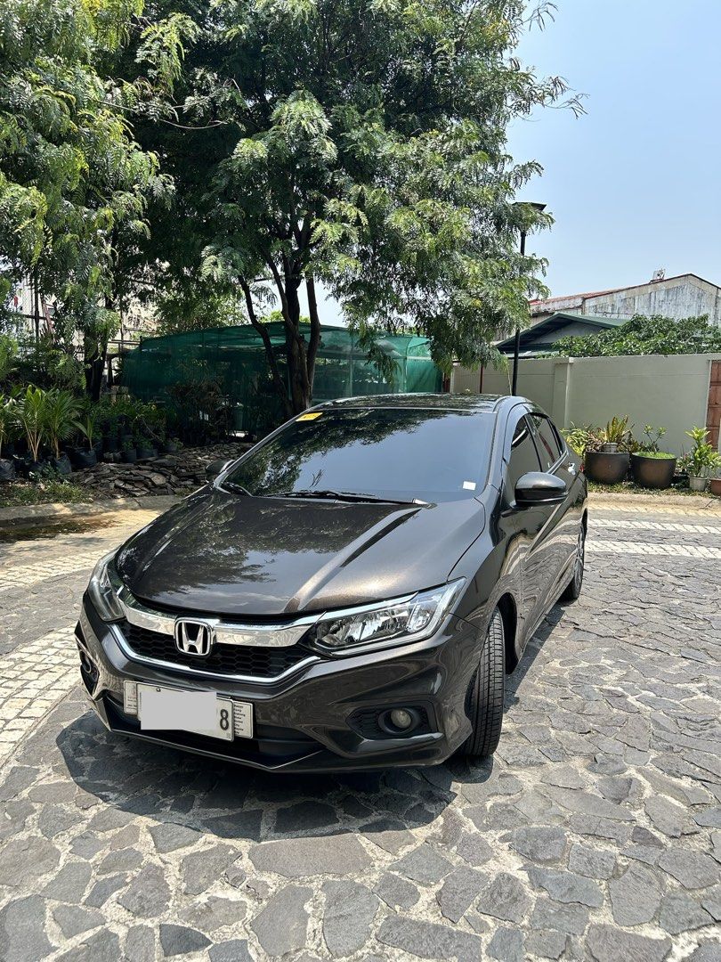 Honda City 1.5 VX Navi Auto (Category: Used Cars) located in Quezon City. Submitted by purplegarage (Listing ID 1457145265, Image 1). Description: 2018 Honda City 1.5 VX Navi Gold Brown Metallic Casa Maintained (Honda Quezon Ave) every 6 months with records Guaranteed 1st Owner Excellent running condition, fresh interior, never had issues with engine, nothing to fix, 100% flood free guaranteed, smooth driving Battery Motolite Gold purchased 10 Au