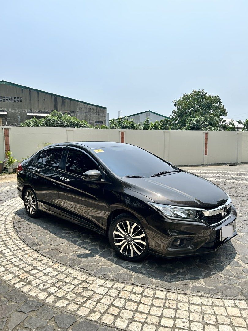 Honda City 1.5 VX Navi Auto (Category: Used Cars) located in Quezon City. Submitted by purplegarage (Listing ID 1457145265, Image 2). Description: 2018 Honda City 1.5 VX Navi Gold Brown Metallic Casa Maintained (Honda Quezon Ave) every 6 months with records Guaranteed 1st Owner Excellent running condition, fresh interior, never had issues with engine, nothing to fix, 100% flood free guaranteed, smooth driving Battery Motolite Gold purchased 10 Au