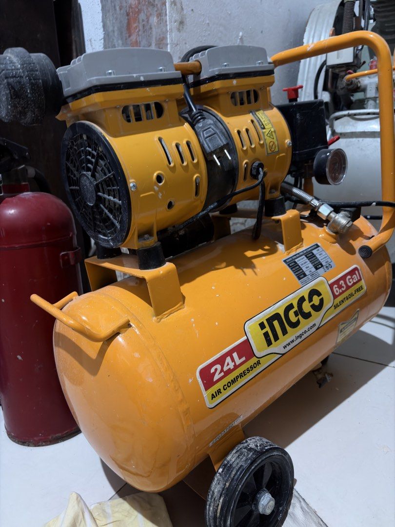 INGCO 24L Silent Oil-Free Air Compressor (Category: Construction Tools & Equipment) located in Cavite. Submitted by boggsbognot (Listing ID 1457187331, Image 2). Description: - INGCO 24L Air Compressor - Silent operation - Oil-free design - 6.3 Gallon tank capacity - Versatile for various tasks - In excellent working condition - Ready for its new owner.