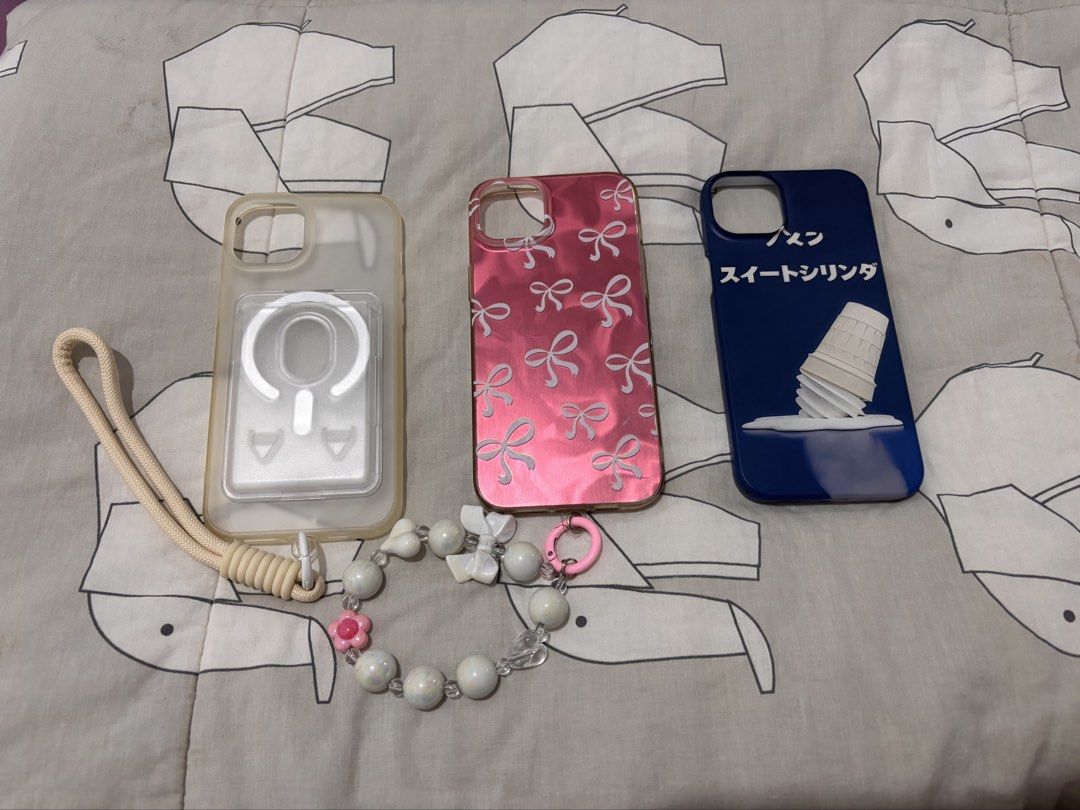 iPhone 15 Plus/14 Plus bundle case (Category: Cases & Sleeves) located in Bacolod City. Submitted by nczr96 (Listing ID 1457267569, Image 3). Description: iPhone 15 Plus/14 Plus bundle case! [1 brand new and 8 preloved but still decent] Brand new: 1 purple liquid silicone case Preloved: 2 pink liquid silicone cases (sand pink and light pink) 1 blue icecream hard case 1 cat ear case 1 purple FRIENDS case 1 yellow Rhode case with FAKE lemontini bal