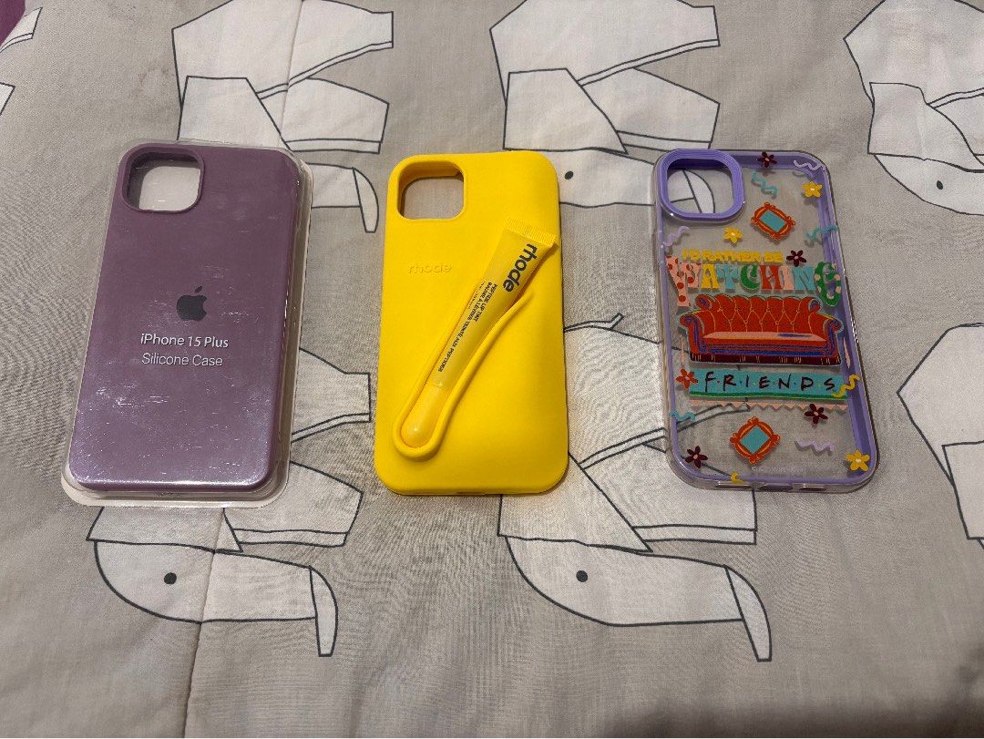 iPhone 15 Plus/14 Plus bundle case (Category: Cases & Sleeves) located in Bacolod City. Submitted by nczr96 (Listing ID 1457267569, Image 1). Description: iPhone 15 Plus/14 Plus bundle case! [1 brand new and 8 preloved but still decent] Brand new: 1 purple liquid silicone case Preloved: 2 pink liquid silicone cases (sand pink and light pink) 1 blue icecream hard case 1 cat ear case 1 purple FRIENDS case 1 yellow Rhode case with FAKE lemontini bal