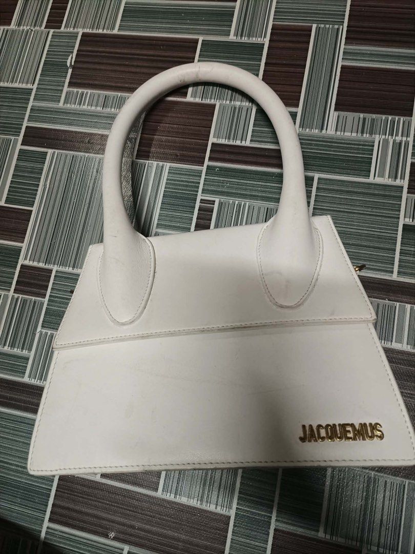 Jacquemus White Leather Top Handle Bag (Category: Luxury Bags & Wallets) located in Victorias. Submitted by lan1877 (Listing ID 1457222293, Image 1). Description: - Authentic White Leather Jacquemus Bag - Elegant Gold Hardware Details - Secure Magnetic Snap Closure - Includes Detachable Shoulder Strap - Expertly Crafted in Italy.