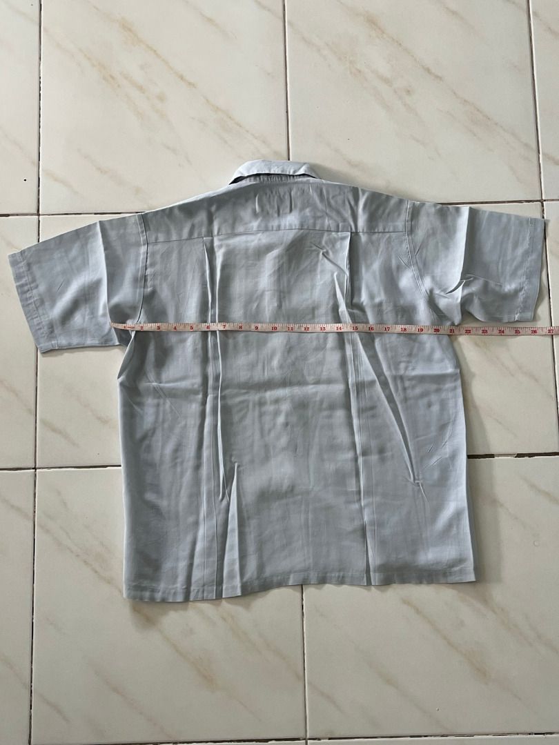 Japanese Mechanic Button Shirt (Category: Tshirts & Polo Shirts ) located in Malolos. Submitted by xixiriri (Listing ID 1457181597, Image 2). Description: Japanese Mechanic Button Shirt Color: Light Gray Style: Button-up with collar Features: Two chest pockets with flaps Material: Lightweight fabric, comfortable for everyday wear Classic workwear-inspired look Length: 24" Width: ~21".