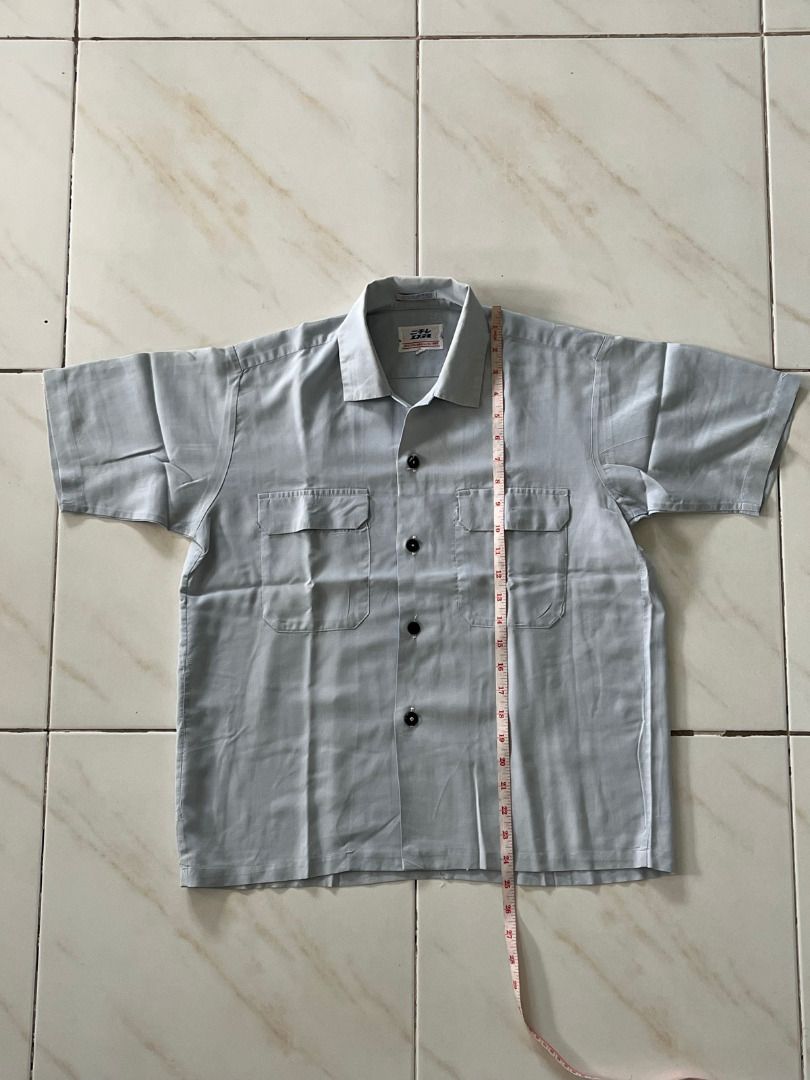 Japanese Mechanic Button Shirt (Category: Tshirts & Polo Shirts ) located in Malolos. Submitted by xixiriri (Listing ID 1457181597, Image 1). Description: Japanese Mechanic Button Shirt Color: Light Gray Style: Button-up with collar Features: Two chest pockets with flaps Material: Lightweight fabric, comfortable for everyday wear Classic workwear-inspired look Length: 24" Width: ~21".