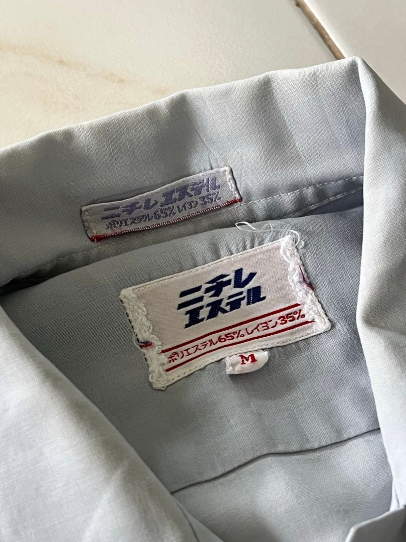 Japanese Mechanic Button Shirt (Category: Tshirts & Polo Shirts ) located in Malolos. Submitted by xixiriri (Listing ID 1457181597, Image 3). Description: Japanese Mechanic Button Shirt Color: Light Gray Style: Button-up with collar Features: Two chest pockets with flaps Material: Lightweight fabric, comfortable for everyday wear Classic workwear-inspired look Length: 24" Width: ~21".