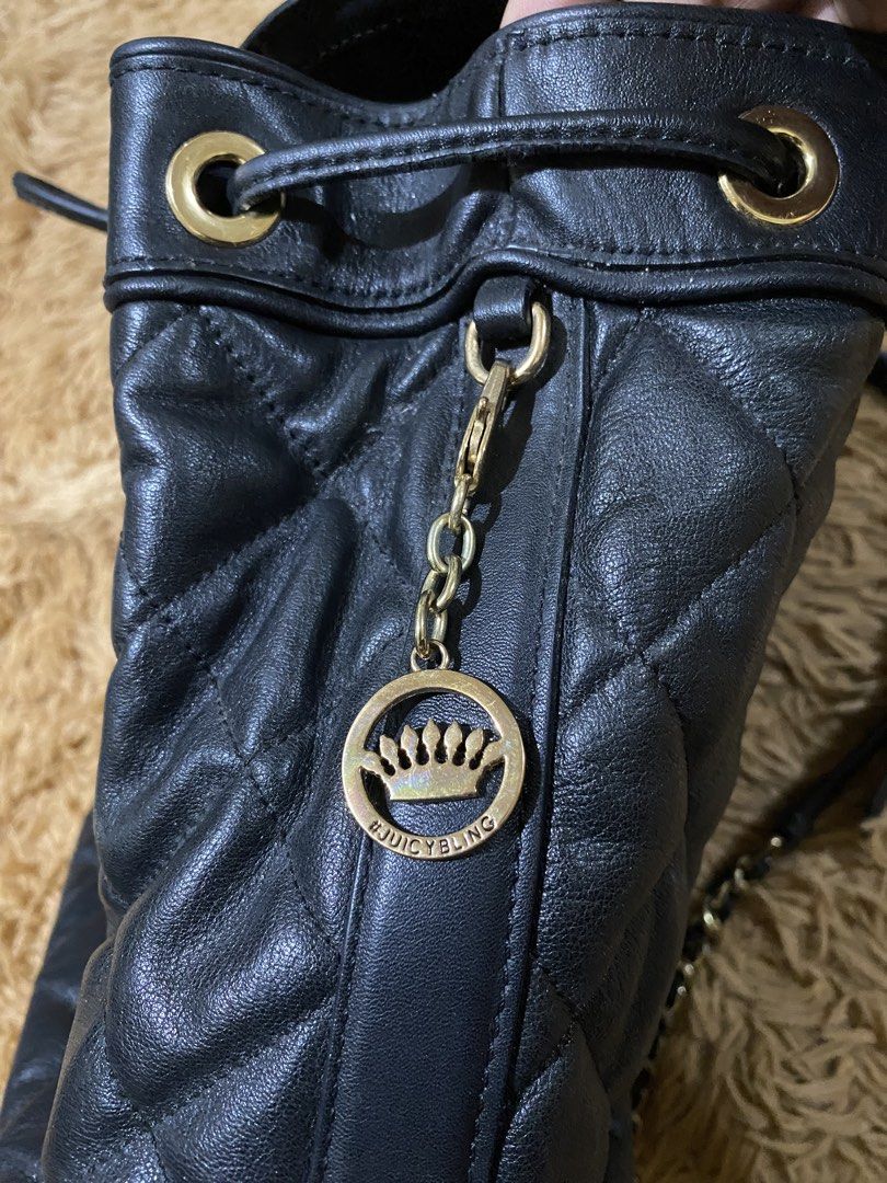 Juicy Couture backpack (Category: Backpacks) located in Cebu City. Submitted by patspickph (Listing ID 1457277852, Image 3). Description: This black quilted leather Juicy Couture backpack features a foldover flap with a gold-tone logo plaque and chain-threaded shoulder straps. Minimal sign of usage only bag in excellent condition👍👌.
