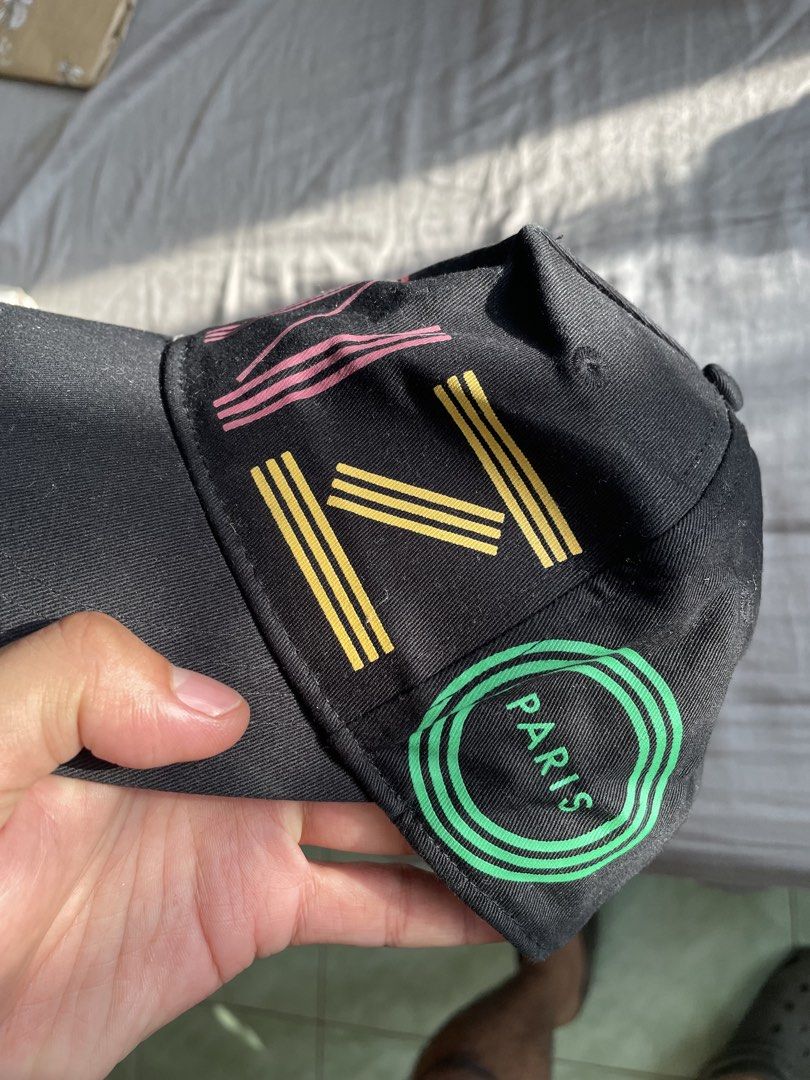 Kenzo Paris Black Cap with Colorful Logo (Category: Caps & Hats) located in Santa Barbara. Submitted by frryt (Listing ID 1457171561, Image 3). Description: - Black Kenzo cap - Features colorful Kenzo Paris logo on front - Adjustable strap at the back - Perfect for everyday wear.
