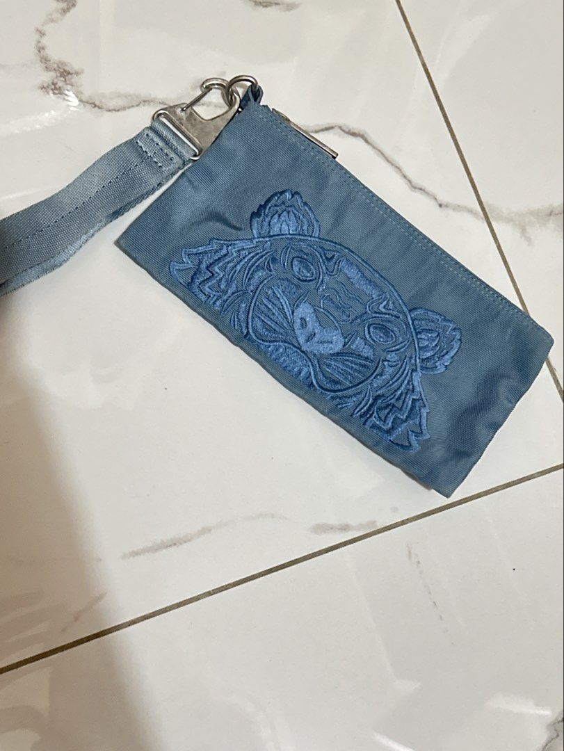 Kenzo Wristlet Bag (Category: Luxury Bags & Wallets) located in Rizal. Submitted by miss2lyps (Listing ID 1455405432, Image 1). Description: - Detachable wrist/shoulder strap - Visible signs of use/wear on the zipper and fabric (needs cleaning!).