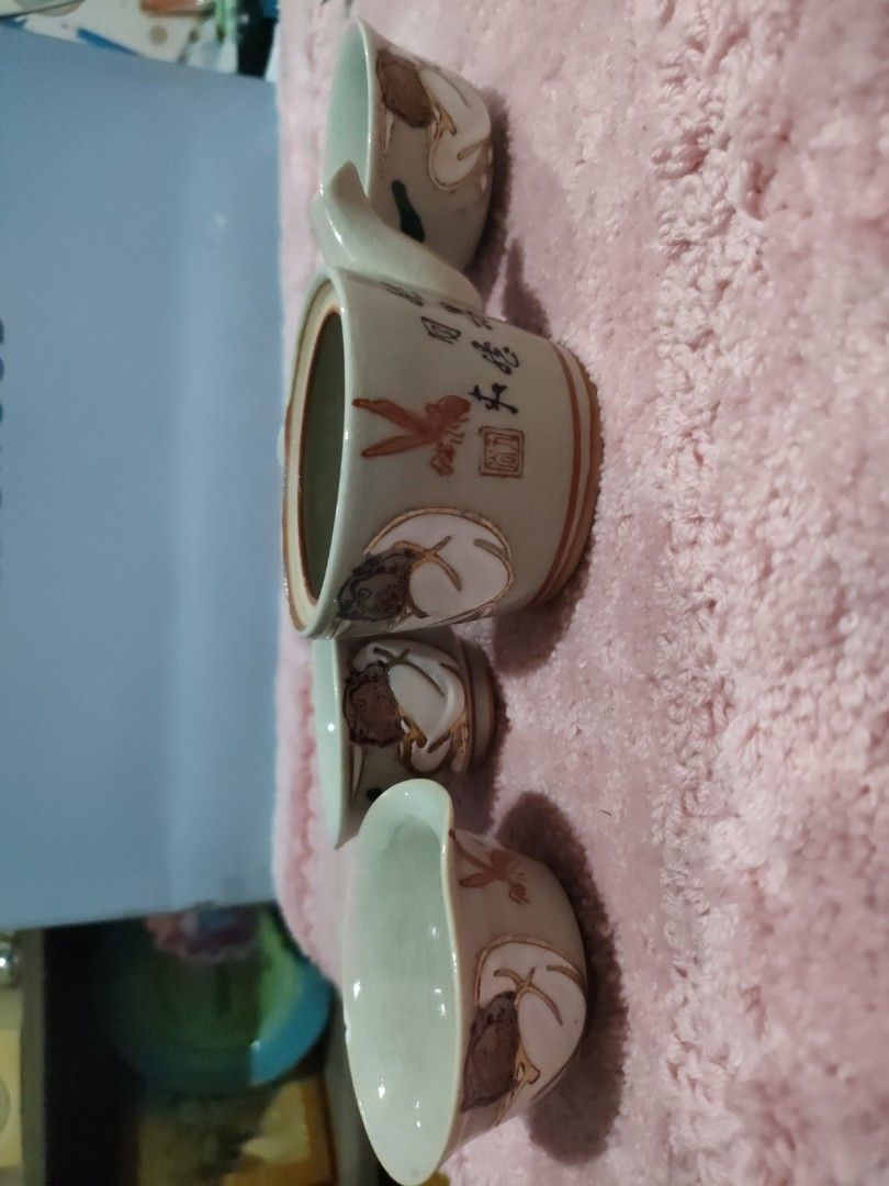 Kutani ware tea Set with Teapot and Cups (Category: Coffee & Tea Tableware) located in Bulacan. Submitted by hunterherojapanjdm (Listing ID 1457288130, Image 3). Description: - vintage Kutani ware tea set features a small ceramic teapot and matching handleless teacups adorned with traditional hand-painted motifs. - Includes teapot and 3 small cups - Features intricate hand-painted designs (insects, mythical creatures) - Lovely crackle glaze effec