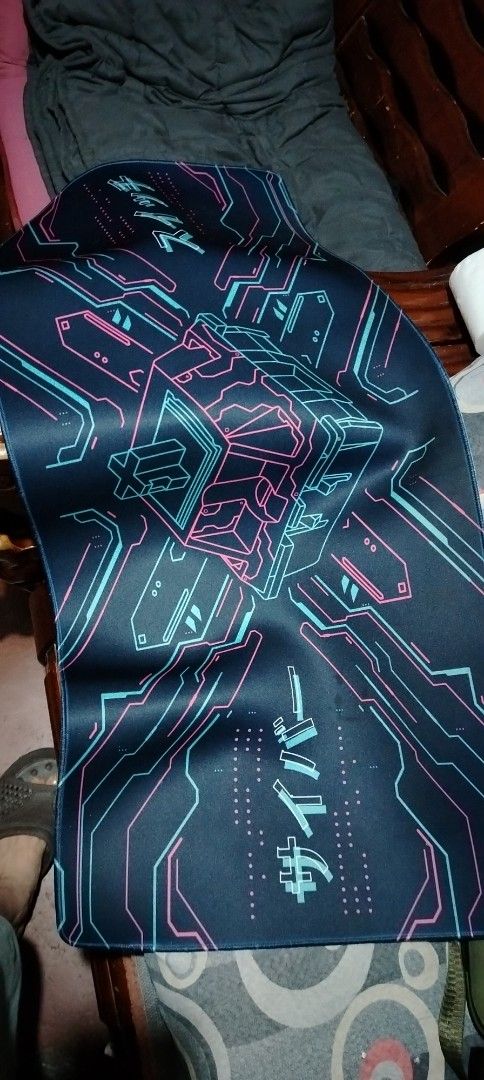 Large Cyberpunk Style Gaming Mousepad (Category: Mouse & Mousepads) located in Manila. Submitted by santanking (Listing ID 1457262771, Image 3). Description: - Large Cyberpunk Mousepad (approx. 80cm x 30cm) - Features a striking cube graphic with neon blue and pink lines - Smooth surface for optimal mouse control - Ideal for enhancing your gaming setup or desk aesthetic - Check photos for the precise design details Malinis na malinis kakalaba ko 