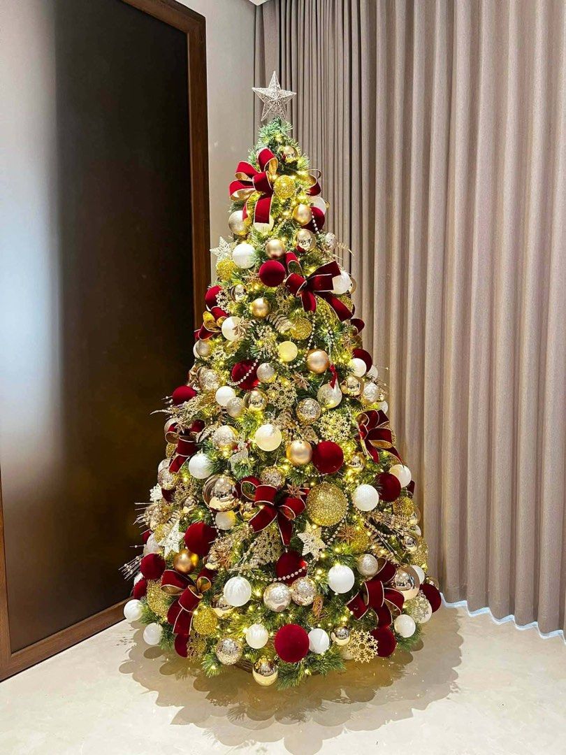 Large Decorated Christmas Tree with Ornaments and Lights (Category: Other Home Decor) located in Manila. Submitted by jamesgani08 (Listing ID 1457149882, Image 3). Description: - Beautifully decorated Christmas tree - Features red, gold, and white ornaments - Includes poinsettias and ribbons - Comes with warm LED lights - Creates a festive atmosphere for home or office - Ready to bring holiday cheer!.