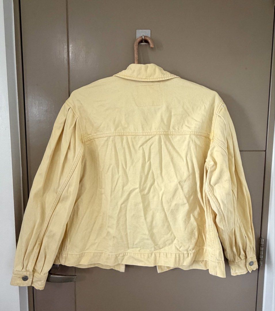 Levi's Yellow Denim Trucker Jacket (Category: Coats, Jackets and Outerwear) located in Manila. Submitted by lifestyle_declutter (Listing ID 1457171235, Image 2). Description: Orig price: around Php 4k - Classic Levi's trucker jacket - Beautiful pastel yellow color - Button front closure - Two chest pockets - Two side pockets - Long sleeves with button cuffs - Size: Medium - Ideal for casual wear.