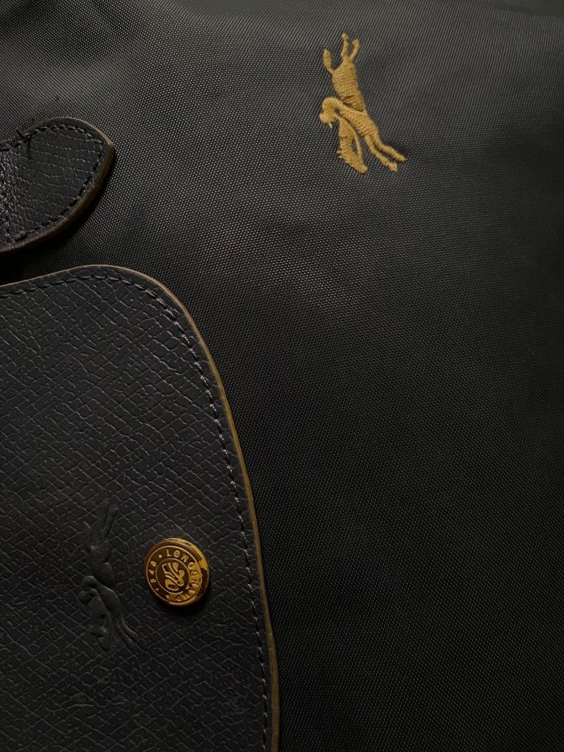 Longchamp Le Pliage Tote Bag (Category: Luxury Bags & Wallets) located in Butuan. Submitted by atab63699 (Listing ID 1457214656, Image 2). Description: - Classic Longchamp tote bag - Durable nylon with leather trim - Features iconic horse logo - Zip closure with snap-button flap - Spacious interior for essentials - Ideal for everyday use.