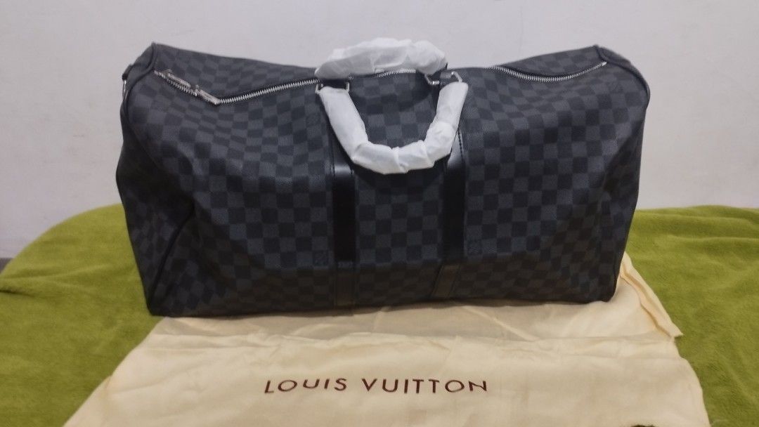 Louis Vuitton Damier Graphite Keepall Duffle Bag (Category: Announcements) located in Zamboanga. Submitted by bravemountain.088106 (Listing ID 1457291539, Image 1). Description: - Louis Vuitton Keepall duffle bag - Stylish Damier Graphite canvas - Includes: shoulder strap, lock, keys, and dust bag - Ideal for travel and weekend getaways.