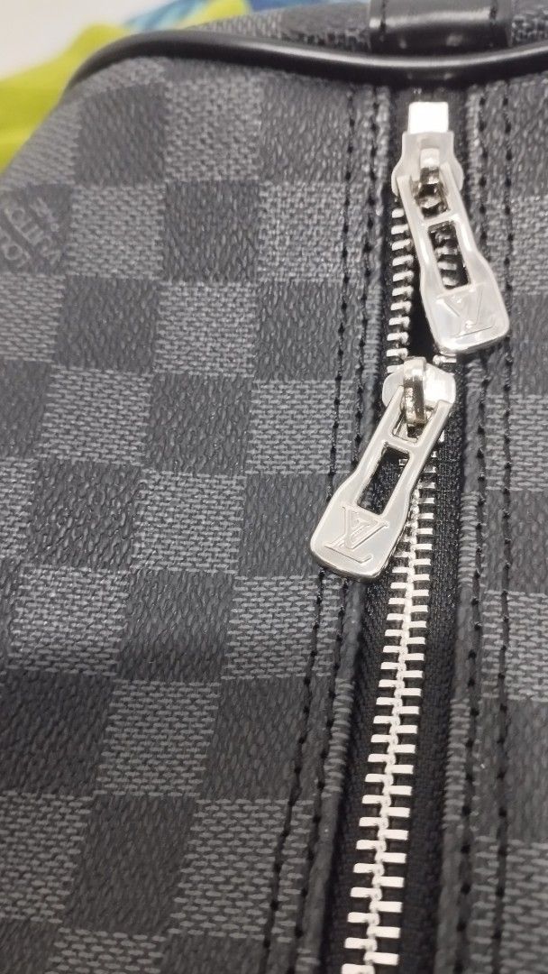 Louis Vuitton Damier Graphite Keepall Duffle Bag (Category: Announcements) located in Zamboanga. Submitted by bravemountain.088106 (Listing ID 1457291539, Image 3). Description: - Louis Vuitton Keepall duffle bag - Stylish Damier Graphite canvas - Includes: shoulder strap, lock, keys, and dust bag - Ideal for travel and weekend getaways.