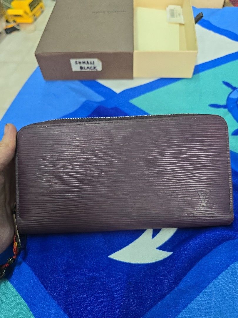 Louis Vuitton Monogram Empreinte Zipped Wallet (Category: Luxury Bags & Wallets) located in Quezon City. Submitted by thegoodsplanetmnl (Listing ID 1457195637, Image 1). Description: - Authentic Louis Vuitton zipped wallet - Vibrant fuchsia pink interior - Multiple card slots and compartments - Smooth working zipper - Perfect for organizing essentials - Comes with original dust bag and box - rfs: dexluterring.