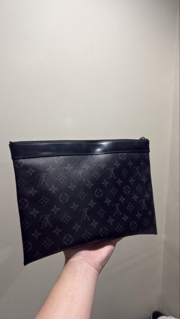 Louis Vuitton Monogram Pouch (Category: Luxury Bags & Wallets) located in Manila. Submitted by wildmoon-b7f0 (Listing ID 1457147923, Image 2). Description: - Classic Louis Vuitton pouch - All-over monogram pattern - Black on black colorway - Leather trim and zipper - Side D-ring for attachment - Ideal for organizing essentials.