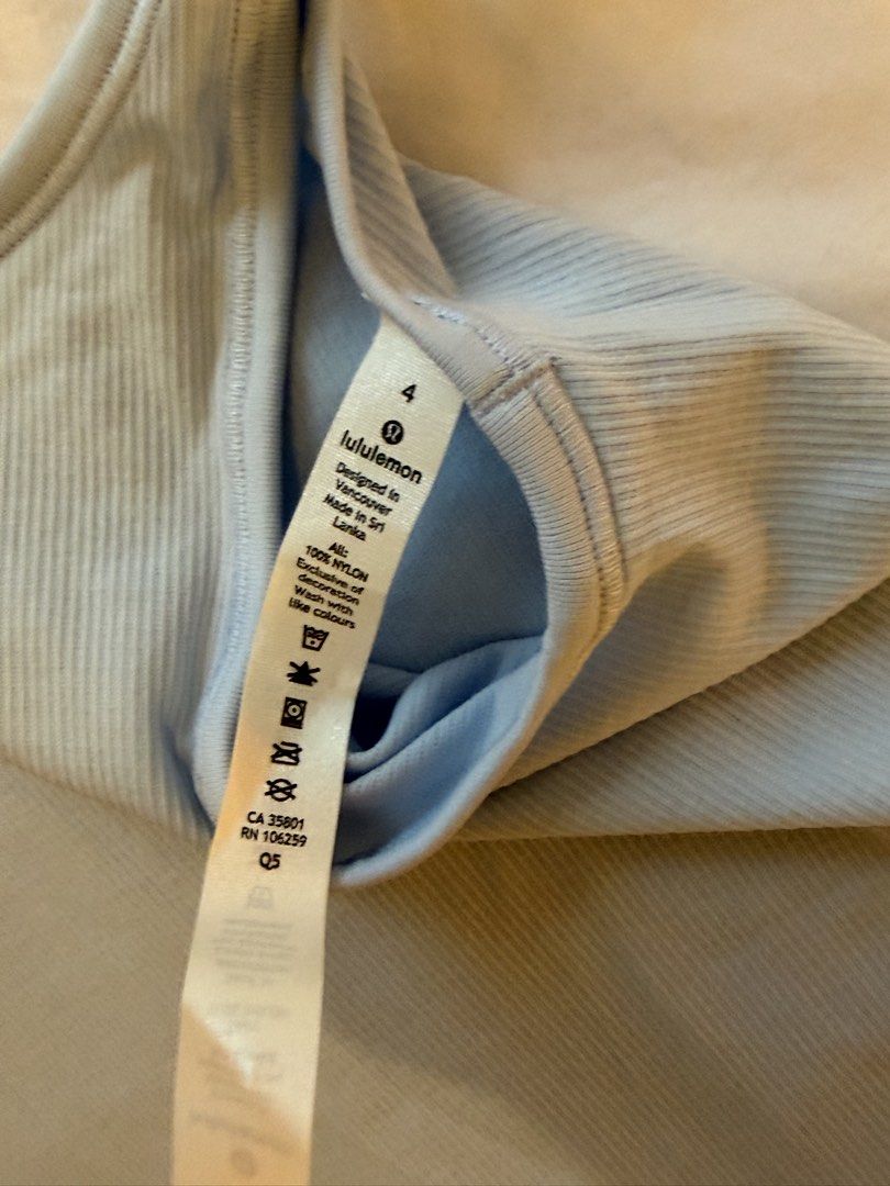 Lululemon Ribbed Tank Top Size 4 Light Blue (Category: Activewear) located in Manila. Submitted by kellygdc (Listing ID 1457191260, Image 2). Description: - Light blue Lululemon tank top - Ribbed texture all over - Scoop neck design - Made in Sri Lanka - Size 4 - Ideal for workouts or casual wear.