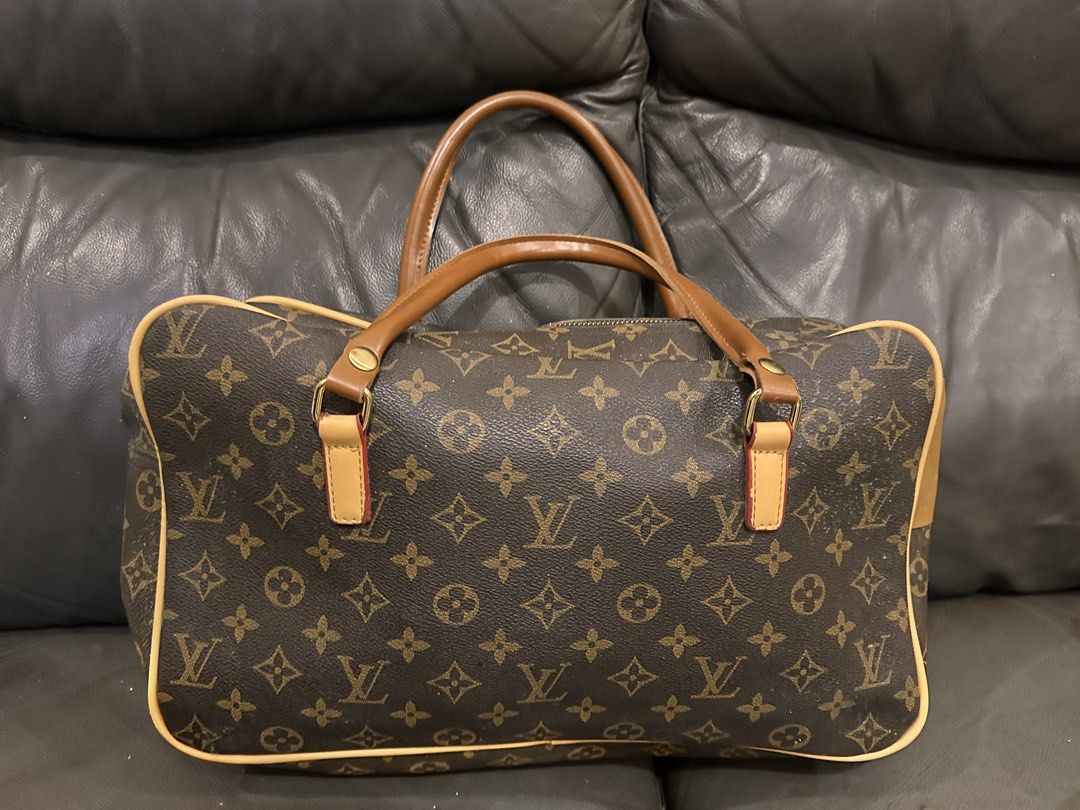 LV Monogram Style Carryall / Boston Bag (Category: Shoulder Bags) located in Manila. Submitted by prettylittlefinds08 (Listing ID 1457316081, Image 1). Description: NO HAGGLING OF PRICE AS THIS IS ALREADY ON SALE! :) Product Details: Style Inspired By: Louis Vuitton Monogram Boston / Carryall Bag Condition: Lightly used (well-structured, clean exterior with minor signs of wear) Color: Classic Brown Monogram with Tan / Honey Leather Trim Features: