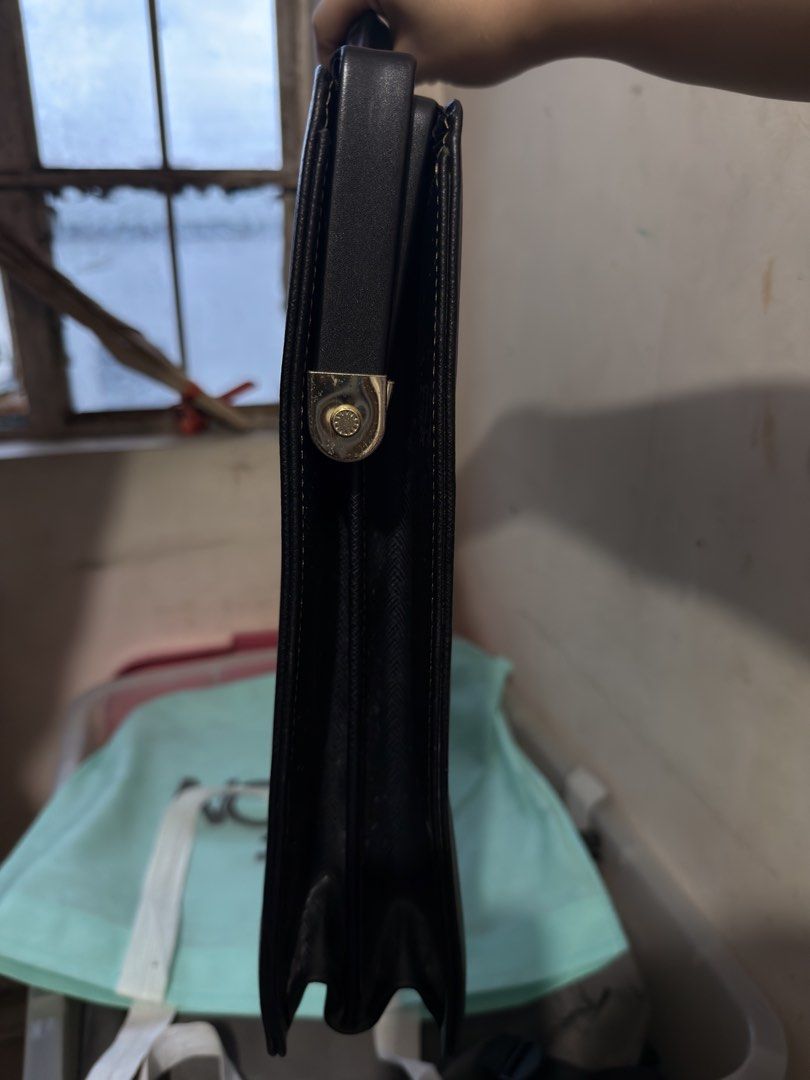 Marie Claire Document Bag (Category: Laptop Bags & Sleeves) located in Quezon City. Submitted by katrinaroncales_ (Listing ID 1457242404, Image 3). Description: Brand: Marie Claire Type: Document Bag Color: Black Hardware: Gold-tone lock closure and accents Material: Textured, leather Style: Classic, professional Condition: Good, pre-owned Additional information about the document bag: - With lock and key ✨ Slightly negotiable .