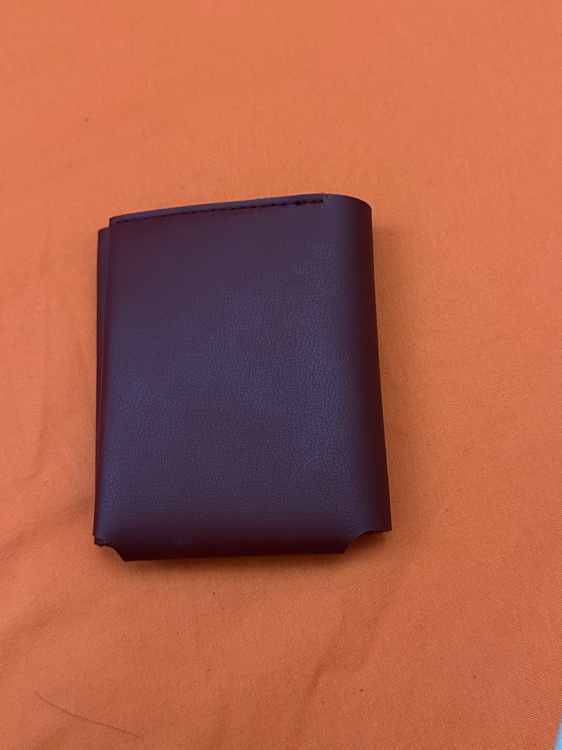 Maroon Leather Bifold Wallet Card Holder (Category: Wallets & Card holders) located in Pulilan. Submitted by jaiesmari (Listing ID 1457266873, Image 1). Description: Maroon leather bifold wallet. Has multiple card slots inside. Also includes a small snap button pouch. Slim design, fits easily in pockets. Good for organizing cards and cash..