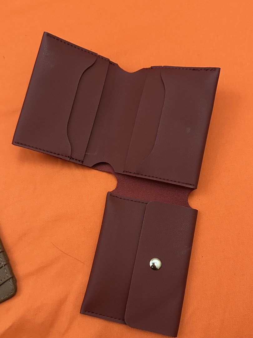 Maroon Leather Bifold Wallet Card Holder (Category: Wallets & Card holders) located in Pulilan. Submitted by jaiesmari (Listing ID 1457266873, Image 2). Description: Maroon leather bifold wallet. Has multiple card slots inside. Also includes a small snap button pouch. Slim design, fits easily in pockets. Good for organizing cards and cash..