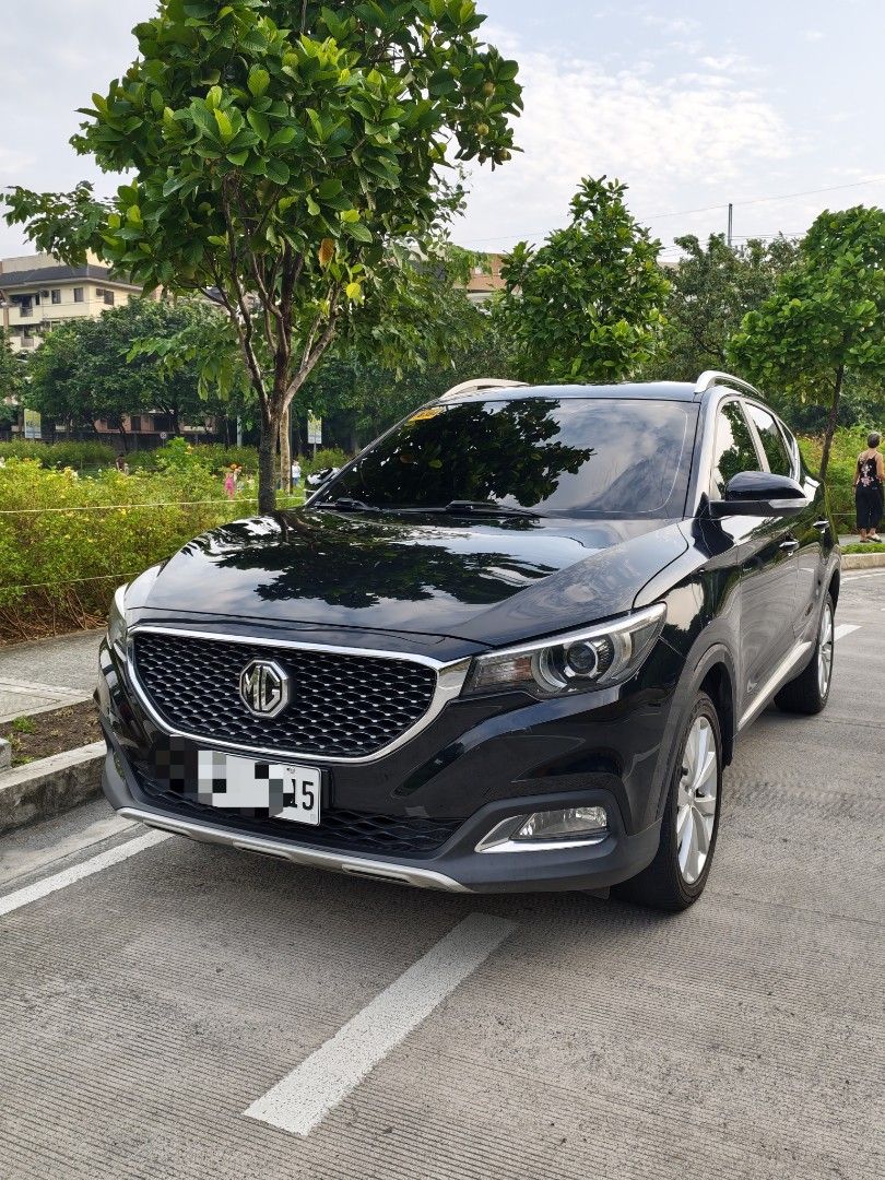 MG ZS (Category: Used Cars) located in Quezon City. Submitted by prelovedbykty (Listing ID 1457252071, Image 2). Description: FOR SALE MG ZS 2023 Php 430,000 (slightly nego) Acquired Sept 2024 (second hand owner) 23,500+ odometer All stocks except for the android unit Stock stereo still on hand (can provide) With spare tire unused Matting included, trunk matting also Sun visors still with plastic Minor scratches due to daily use Ceramic coated la