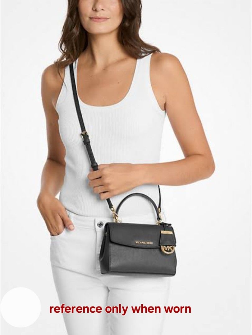 Michael Kors Ava Extra-Small Crossbody Bag (Category: Luxury Bags & Wallets) located in Davao. Submitted by wengbagstuff (Listing ID 1457141740, Image 2). Description: ✅️ extra small size, saffiano leather ✅️ signs of usage-dryness sa top handle (see pics).