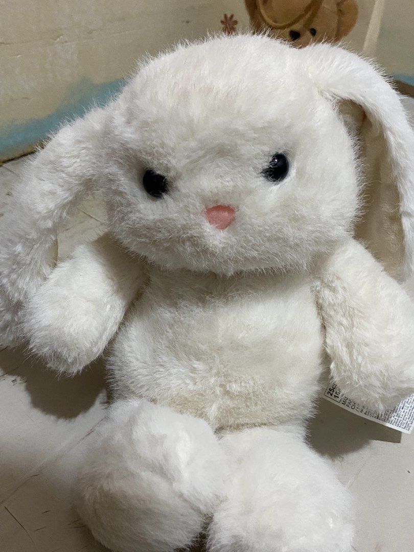 MINISO White Fluffy Bunny Rabbit Plush Toy (Category: Plushies & Soft Toys) located in Manila. Submitted by jelikaxia (Listing ID 1457161049, Image 1). Description: - Super soft white bunny plush - Cute pink nose and black eyes - Perfect for cuddles or room decoration - Floppy and soft ears - Great gift idea for kids or bunny lovers - Measures about 25cm.